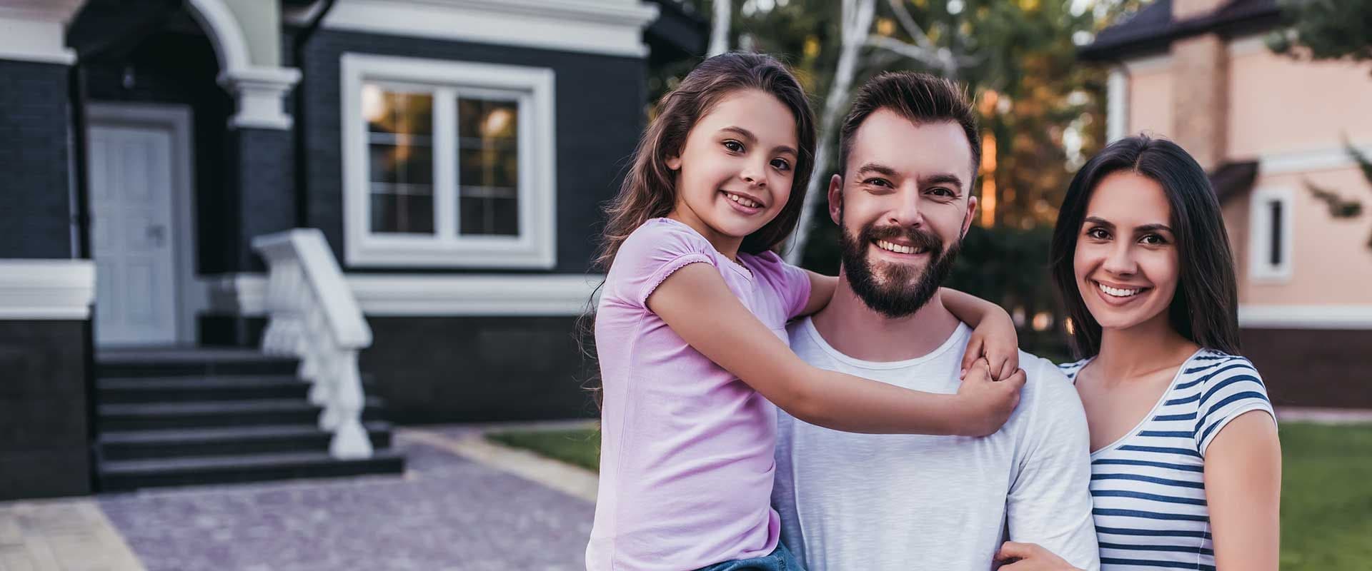Family in front of home